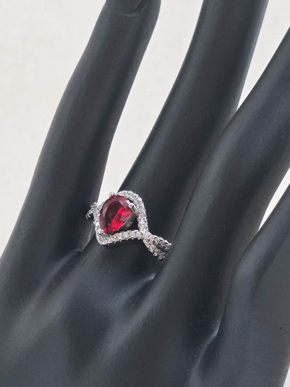 Sterling-Inspired Silver Ring with Pear-Shaped Red Gem and Pavé Halo
